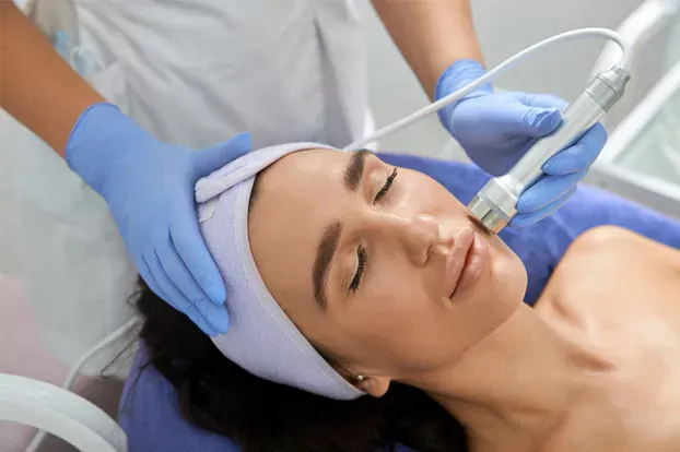 Women getting facial hair removed through laser hair removal service.
                  