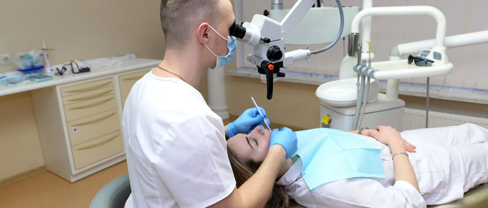 Dentist treating patient at a dental implant clinic

