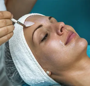 Organic facial peel treatment at a cosmetic skin care clinic.
