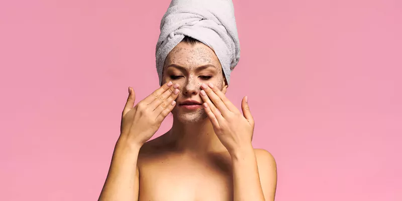 Monsoon skin care tips - a woman with an exfoliating mask on her face.