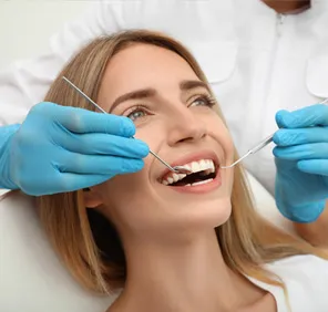 Woman getting her teeth examined.
