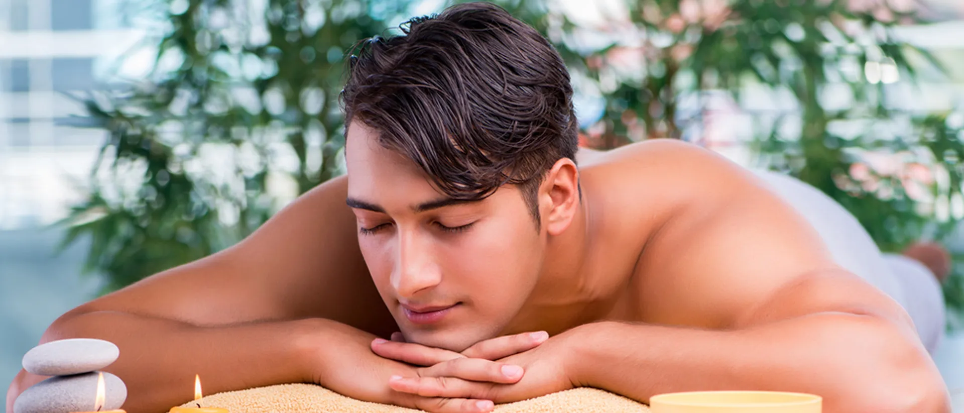 Man relaxing during an aromatherapy massage.