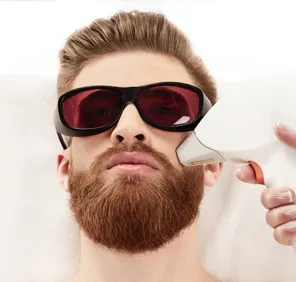 Man getting laser treatment for beard facial hair.
