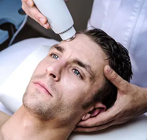 Man getting an anti-aging treatment at a skin and hair clinic.
