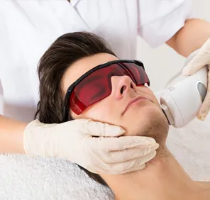 Man getting a Insta Glow Laser at a skin and hair clinic.
