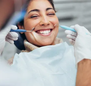 Dental care service - woman getting a dental treatment.