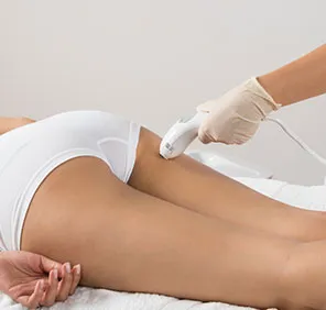 A full body laser hair removal treatment carried out on the buttocks of a woman.
