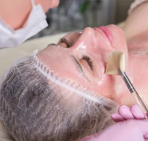 Woman getting a Glow Peel at a cosmetic skin care clinic.

