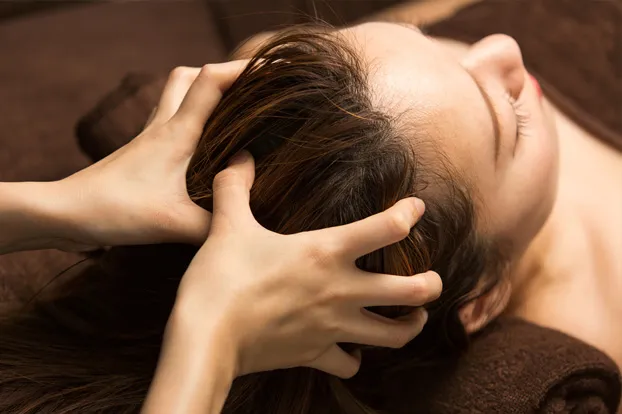 Woman getting a head massage
