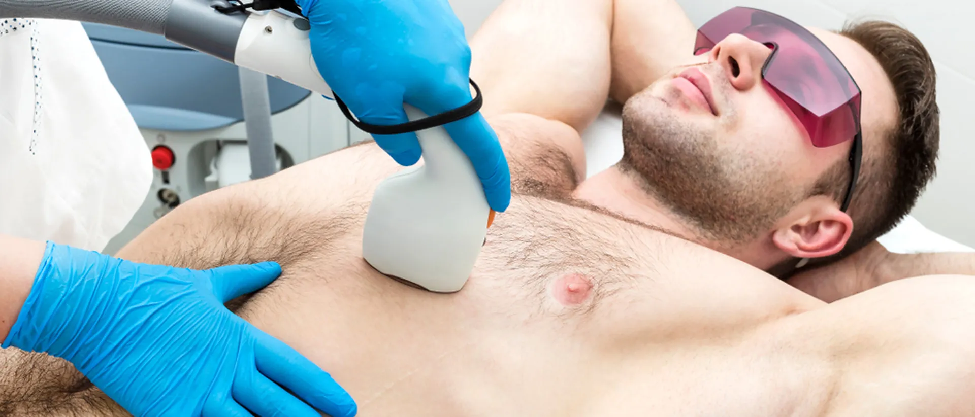 Man getting chest hair removed through laser hair removal service
               