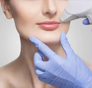 Woman getting laser hair removal treatment for upper lip.
